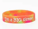 A big sister wristband with the message " i 'm a big sister ".