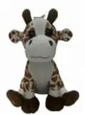 A stuffed giraffe is sitting down and looking at the camera.
