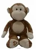 A brown and white stuffed monkey sitting on top of a floor.